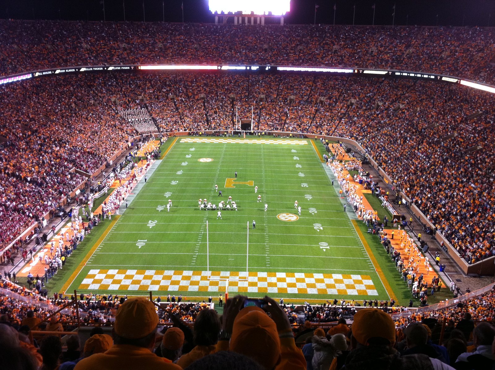 Packed Neyland Stadium during the 2012 Alabama–Tennessee football game, with the field and orange-and-white checkerboard end zone
