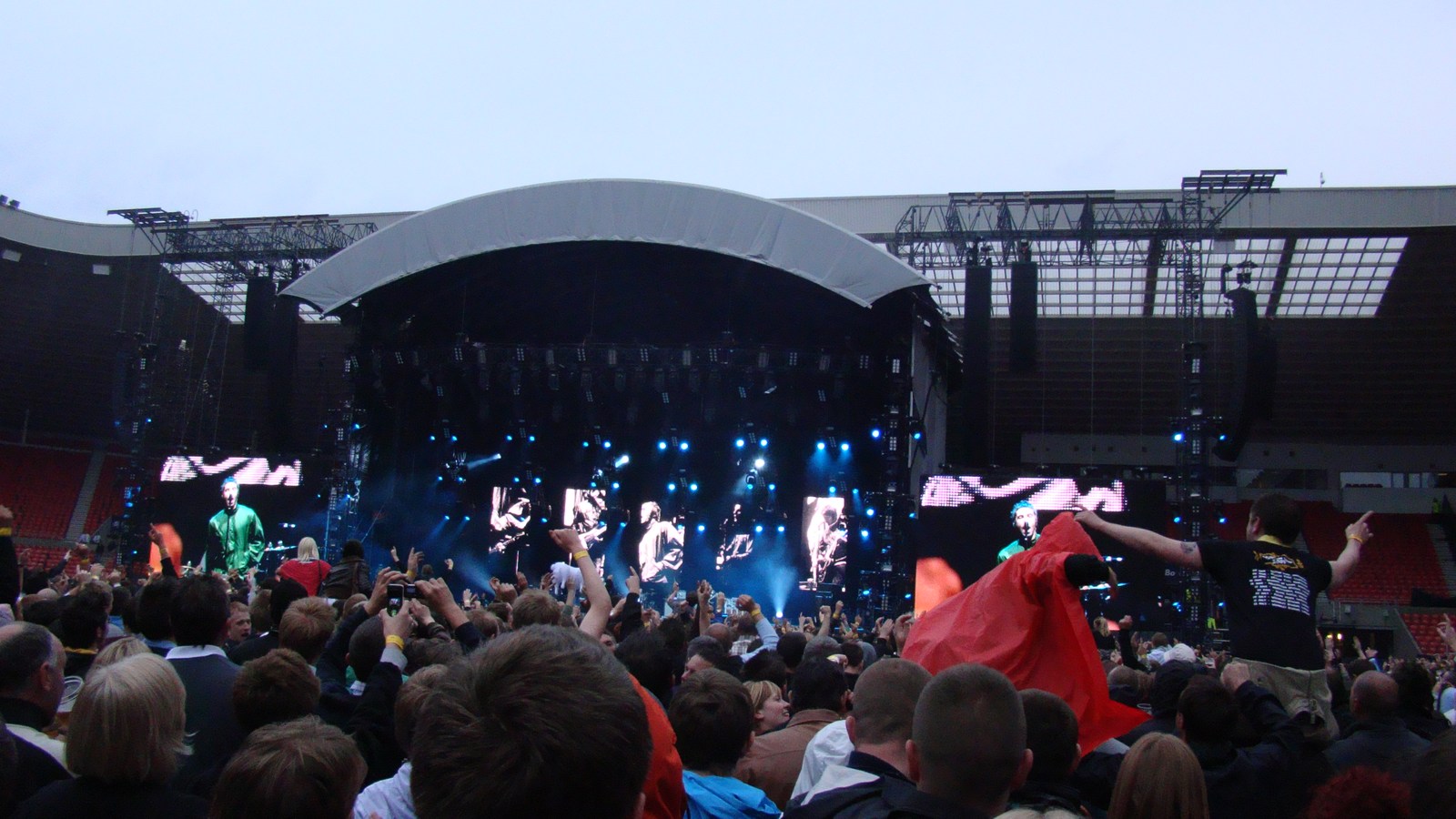 Concert audience enjoying a live performance, illustrating a luxury van weekend with friends