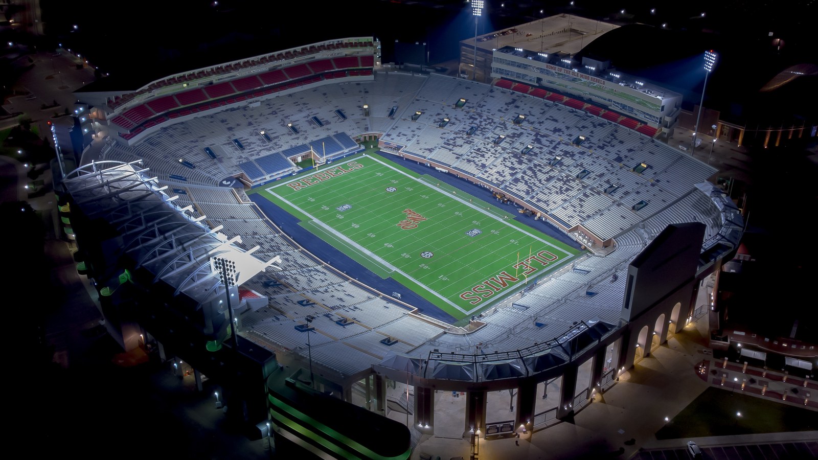 Vaught-Hemingway Stadium illuminated at night in Oxford, Mississippi