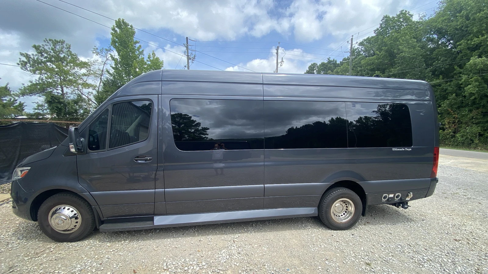 Dufourfun-owned luxury passenger van photographed outdoors; illustrative travel image, not Tuscaloosa, the stadium, or event access.