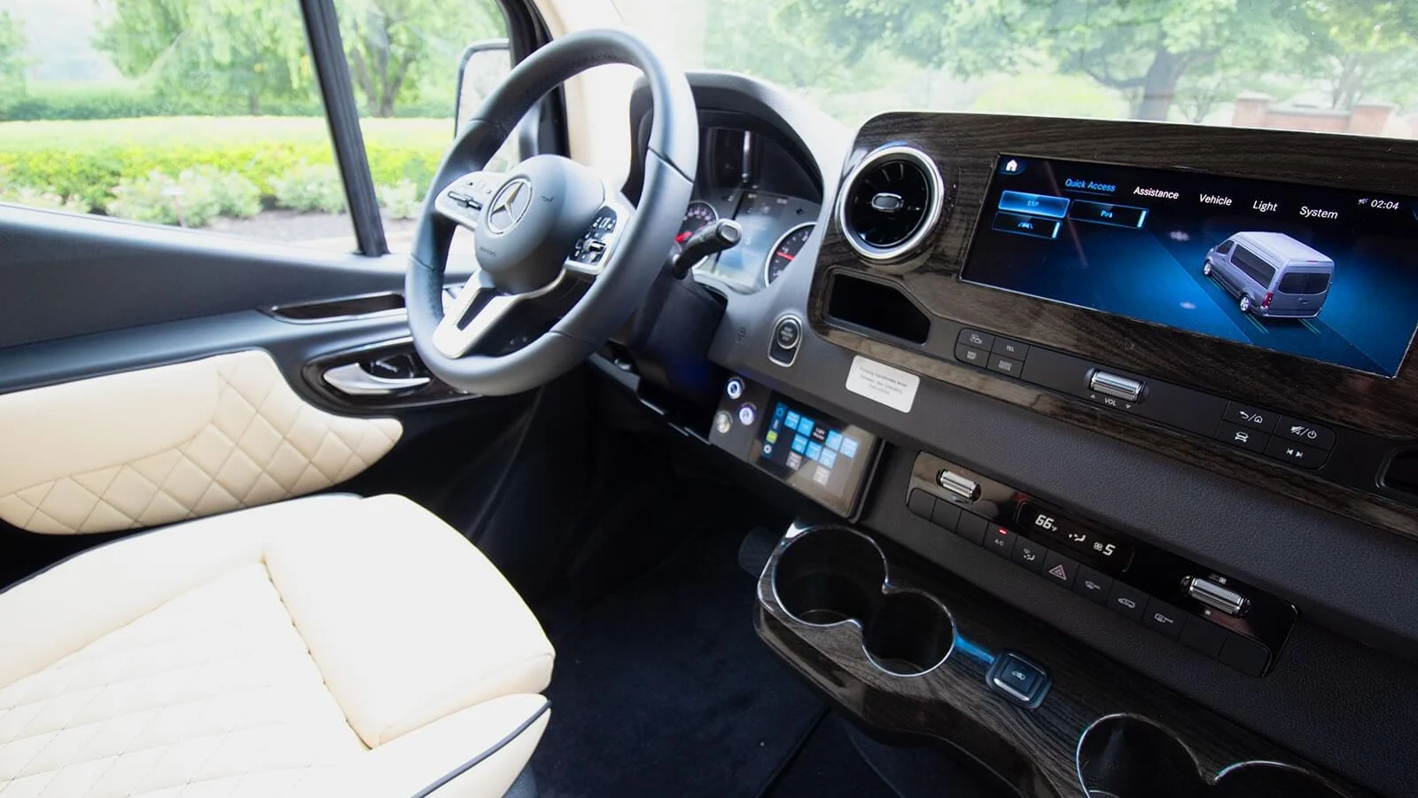 Illustrative cream front seat and dashboard in a luxury van; seat rotation is not depicted.