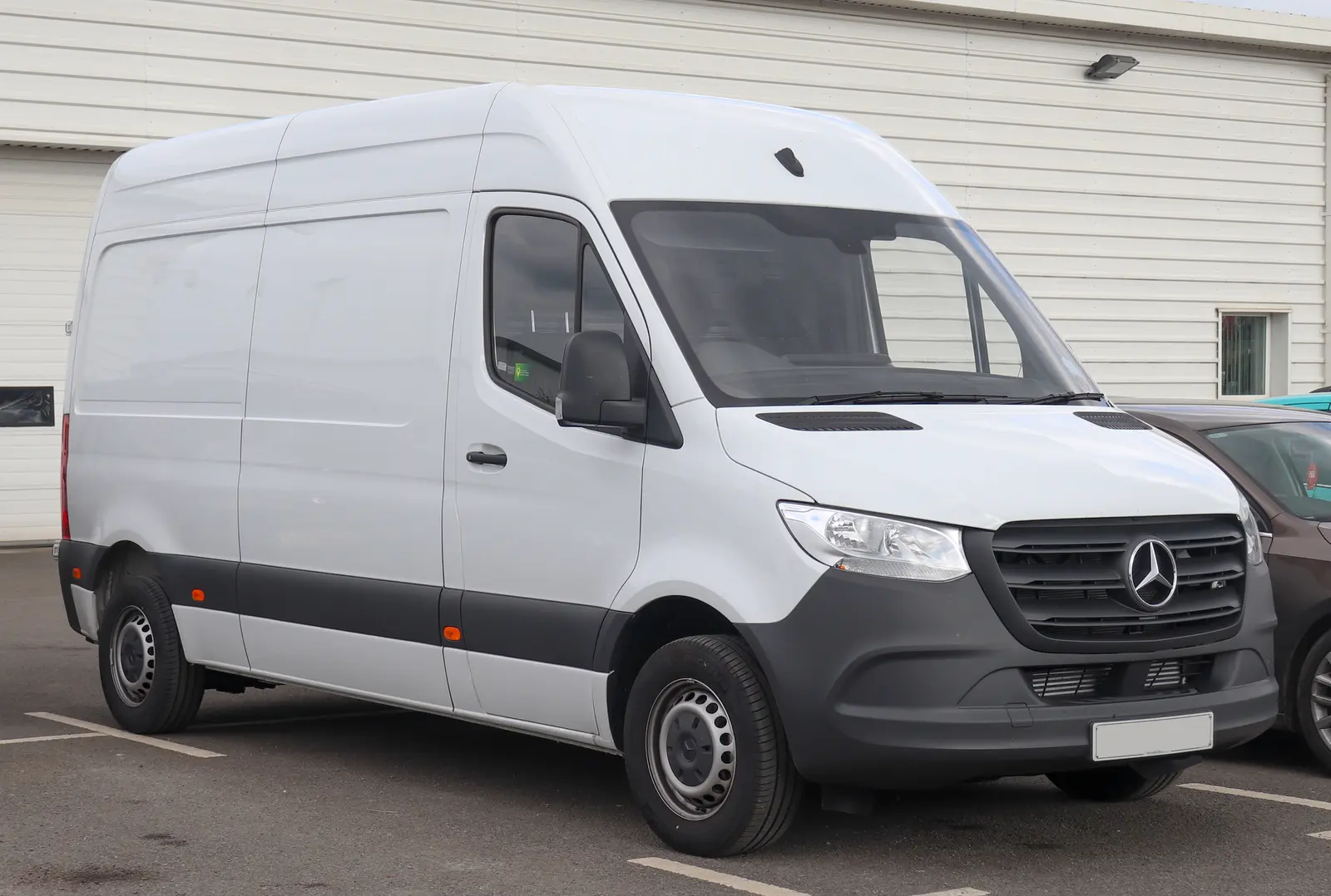 White 2019 Mercedes-Benz Sprinter panel van parked outdoors, shown from the front three-quarter angle